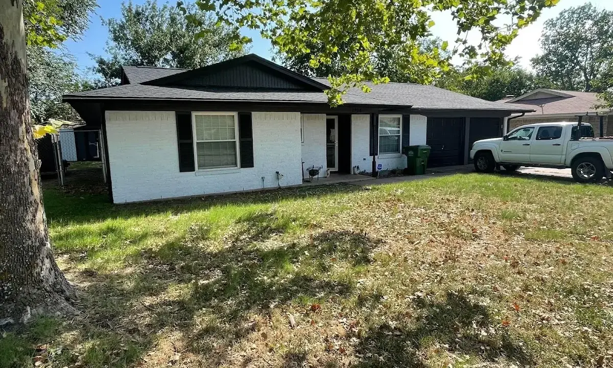 Professional roofing crew working on a residential roof in St. Matthews